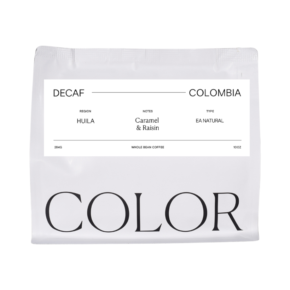 The Pull & Pour Shop Decaf Colombia Huila coffee bag with minimalist white packaging and black typography.