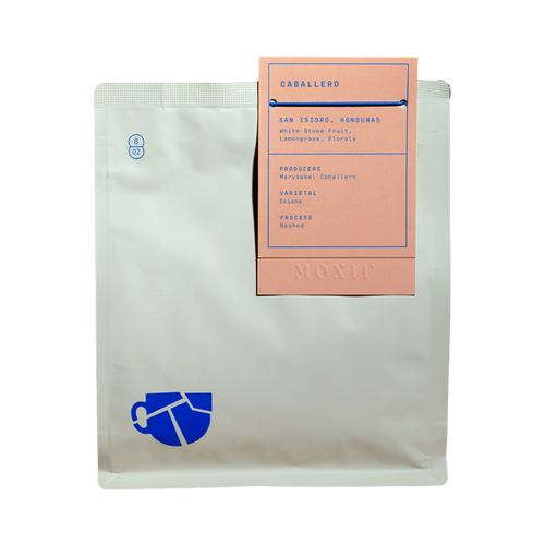 The Pull & Pour Shop Caballero Washed Geisha Honduras coffee bag with a peach label and blue text on a white pouch.