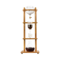 The Pull & Pour Shop Yama Glass Cold Brew Tower with a bamboo frame and hand-blown borosilicate glass components.