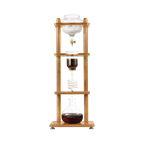 The Pull & Pour Shop Yama Glass Cold Brew Tower with a bamboo frame and hand-blown borosilicate glass components.