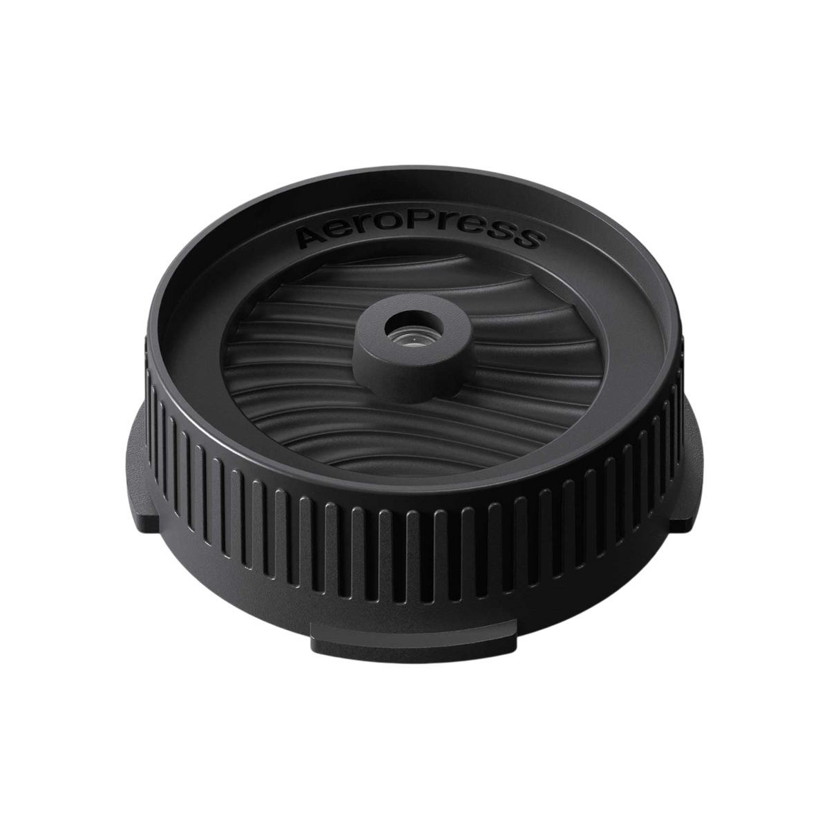 The Pull & Pour Shop AeroPress Flow Control Filter Cap in black plastic with a pressure-actuated valve design.