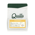 The Pull & Pour Shop Quills Coffee Blacksmith espresso blend bag with white packaging and green top trim