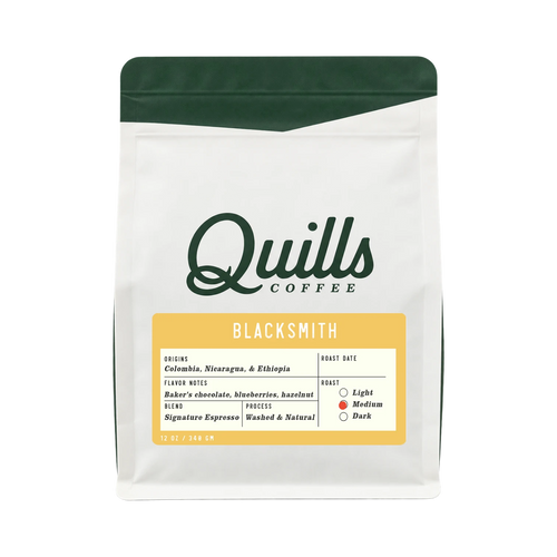 The Pull & Pour Shop Quills Coffee Blacksmith espresso blend bag with white packaging and green top trim