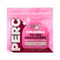 The Pull & Pour Shop Colombia Young Producers coffee bag in bright pink with strawberry and frosting illustrations.