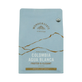 The Pull & Pour Shop organic Colombia Agua Blanca medium light roast coffee bag in light blue with gold accents.