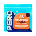 The Pull & Pour Shop PERC COFFEE Colombia Huila decaf coffee bag in bright blue packaging with orange label