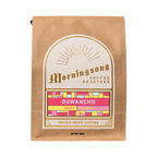The Pull & Pour Shop Duwancho Ethiopia honey processed whole bean coffee in a brown kraft paper bag with gold label