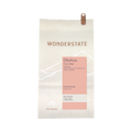 The Pull & Pour Shop Ethiopia Okoluu coffee bag featuring a light cream paper design with a soft pink label.