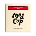 The Pull & Pour Shop medium-roast decaf coffee bag in gold packaging with bold black branding and red label detail.