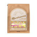 The Pull & Pour Shop Halo Beriti Ethiopia whole bean coffee in a brown paper bag with a decorative gold label.