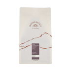 The Pull & Pour Shop Honduras Finca Liquidambar coffee bag with white packaging and brown mountain graphic design