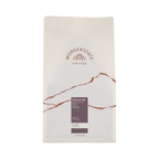 The Pull & Pour Shop Wonderstate Coffee Kenya Gatura AA 5lb bag with minimalist white packaging and brown mountain art.
