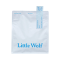 The Pull & Pour Shop Little Wolf Companion Blend coffee bag in white with blue branding and tasting notes.