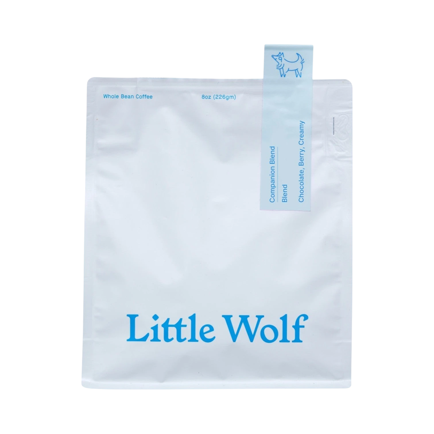 The Pull & Pour Shop Little Wolf Companion Blend coffee bag in white with blue branding and tasting notes.