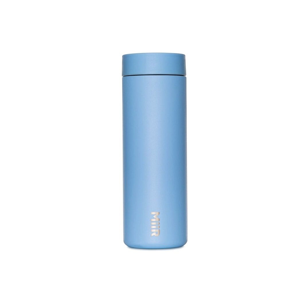 The Pull & Pour Shop MiiR 360 Traveler insulated travel tumbler in light blue with a leakproof 360-degree lid.