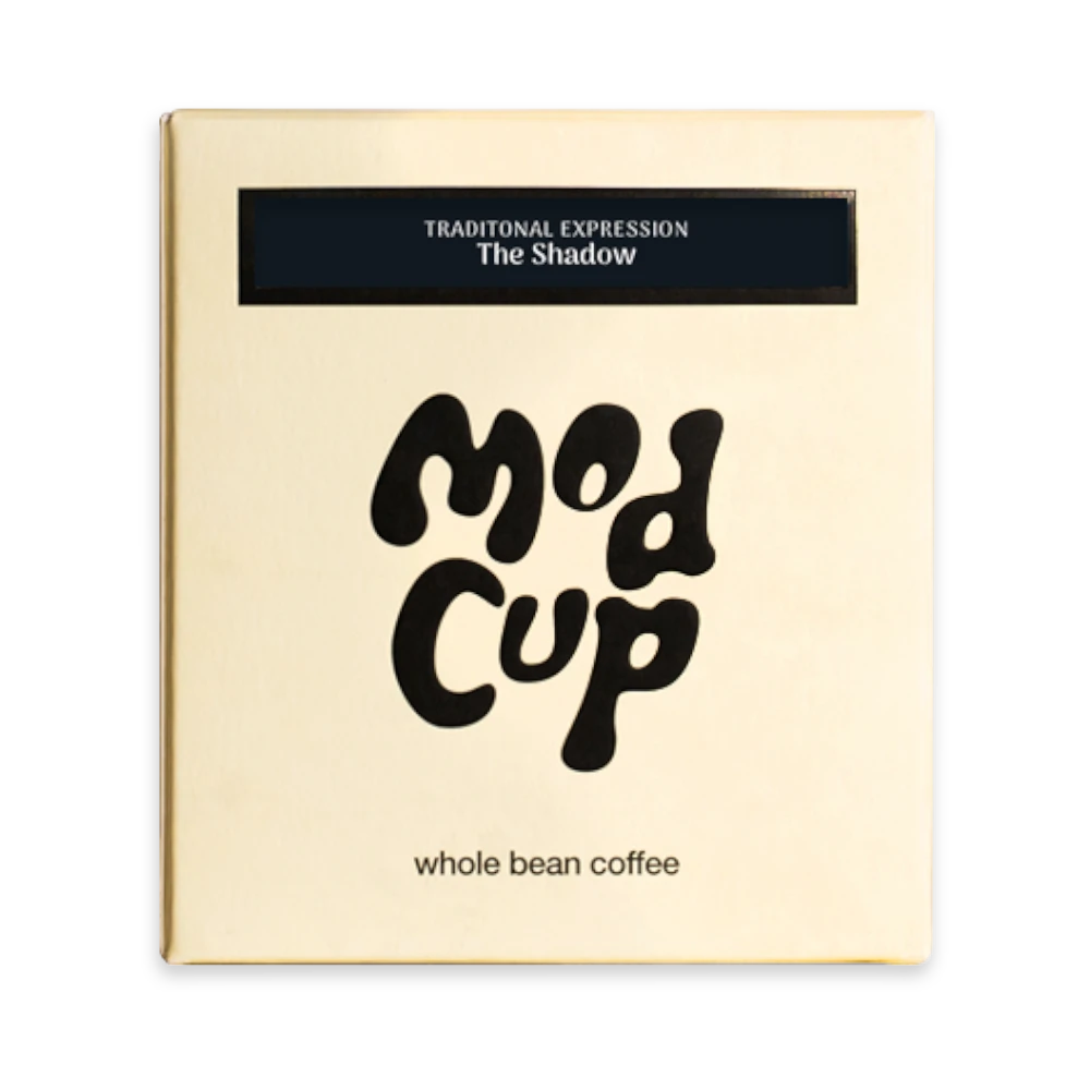 The Pull & Pour Shop Modcup Coffee The Shadow dark roast whole bean coffee in a gold square box.