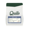 The Pull & Pour Shop Quills Coffee Night Owl dark roast coffee bag with white packaging and dark green accents.