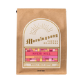 The Pull & Pour Shop Nyeri Hill Kenya whole bean coffee in a brown kraft paper bag with a decorative gold label.