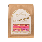 The Pull & Pour Shop Nyeri Hill Kenya whole bean coffee in a brown kraft paper bag with a decorative gold label.