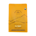 The Pull & Pour Shop Organic Flyway medium roast coffee bag in bright yellow packaging with a mountain graphic.