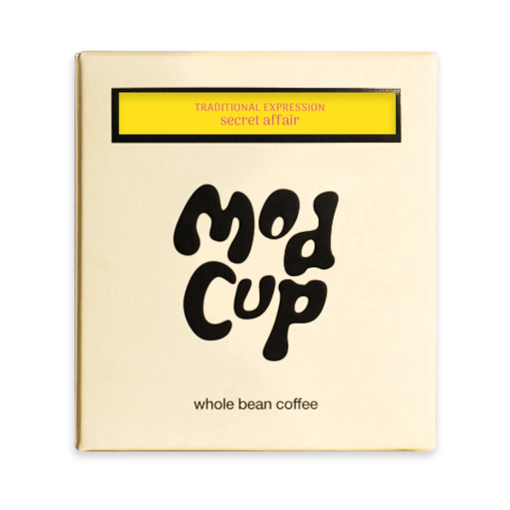 The Pull & Pour Shop Secret Affair 2.0 whole bean coffee box in cream packaging with yellow and black label details.