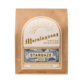 The Pull & Pour Shop Stargaze decaf whole bean coffee in a brown paper bag with a decorative geometric label.