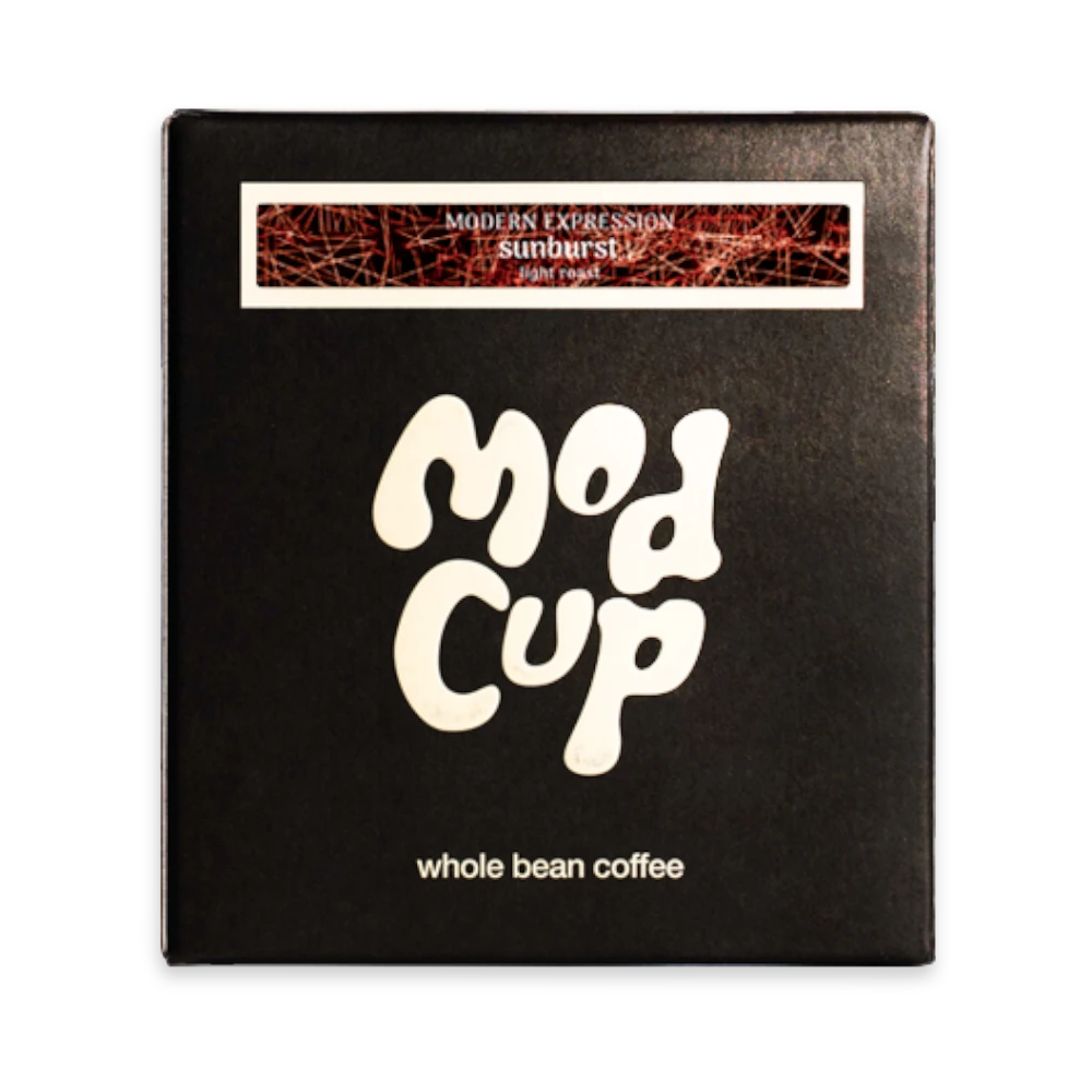 The Pull & Pour Shop Sunburst Blend light roast whole bean coffee in a black box with modern white typography