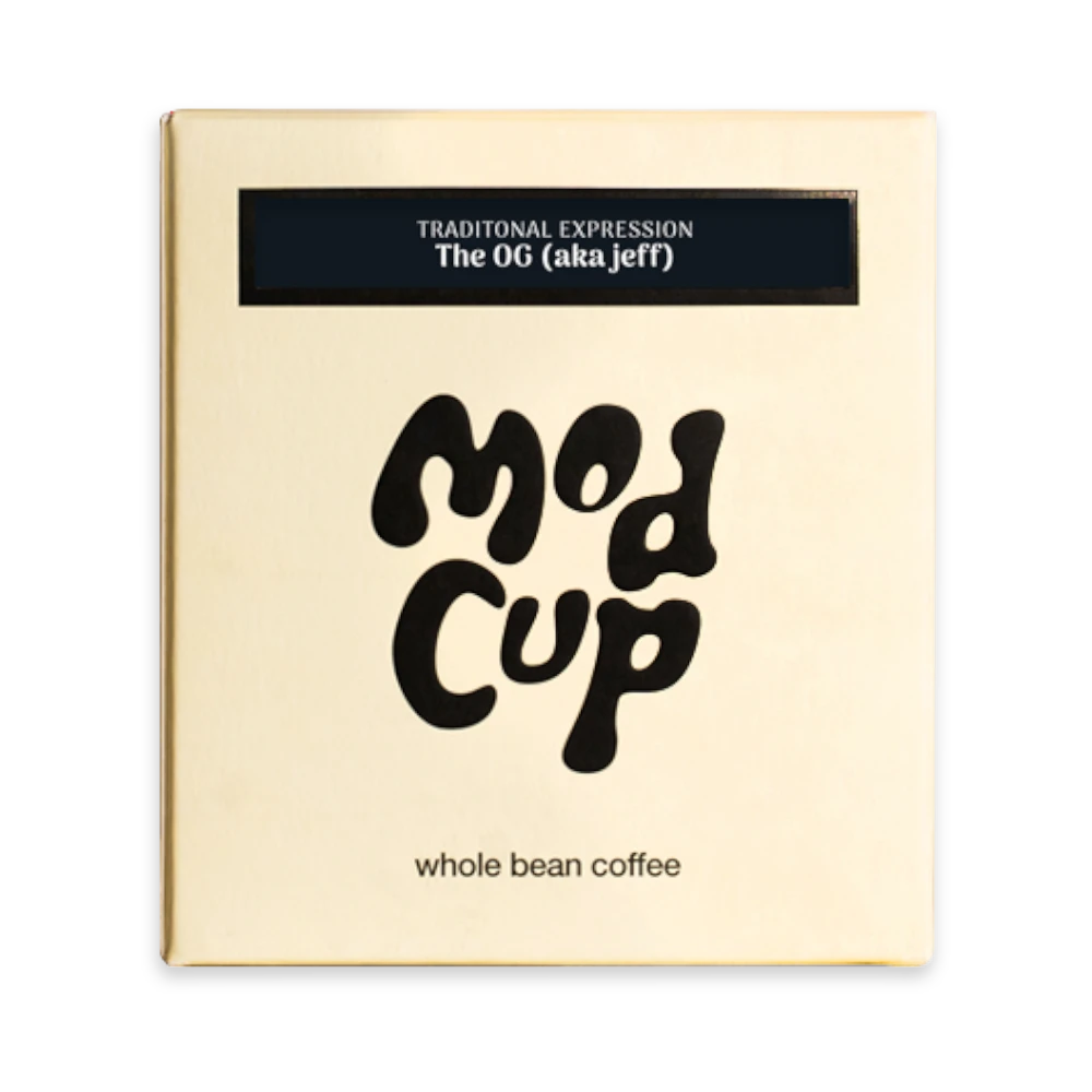 The Pull & Pour Shop The OG (aka Jeff) medium roast whole bean coffee in a cream-colored box with black branding.