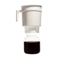 The Pull & Pour Shop Toddy Home Cold Brew System with white brewing container and glass decanter of coffee concentrate